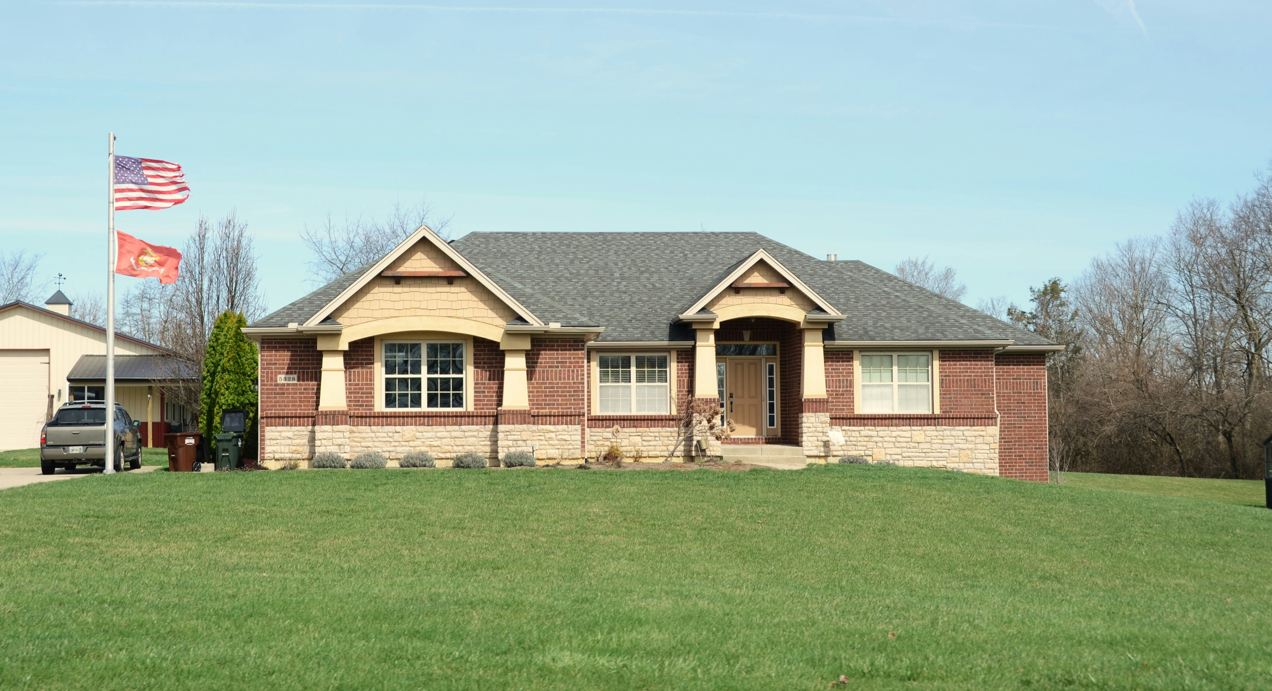 Plain yard and house frontage before landscape redesign